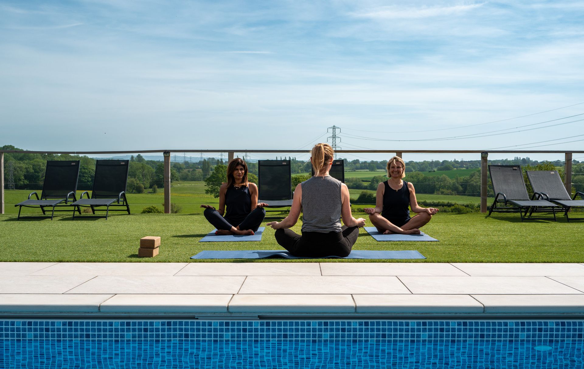 Outdoor yoga by the pool